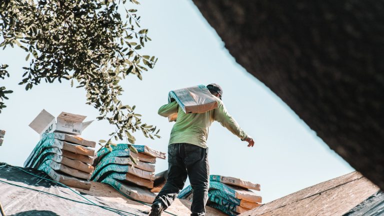 a man riding a skateboard on top of a roof