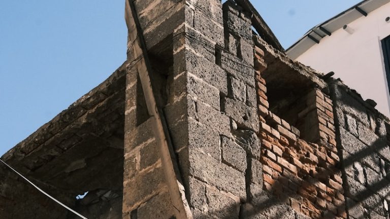 A brick building with a clock on the side of it