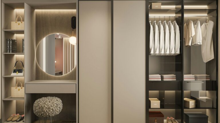 a walk in closet with a mirror and a stool